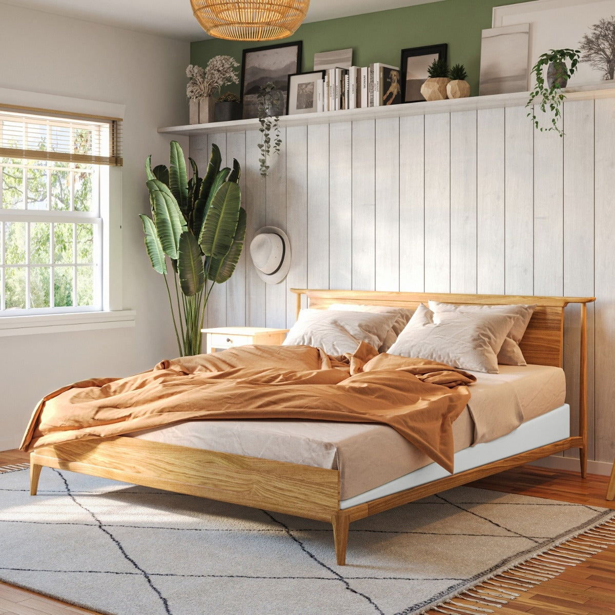 Wooden bed in a bedroom with a window, plants, and shelves.