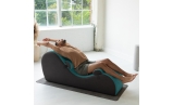 Man in stretching pose on CHAKRA Yoga Chaise